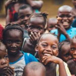 Smiling children at the Carmel Daycare Centre in Nairobi