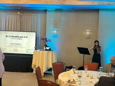 Sarah performing violin at the AI in Healthcare event
