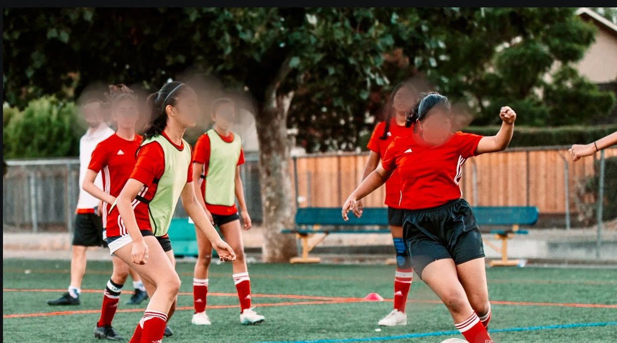 Girls' soccer players receiving financial assistance